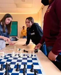 Chess club discussing strategies