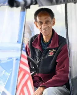 Facilities staff member in a golf cart